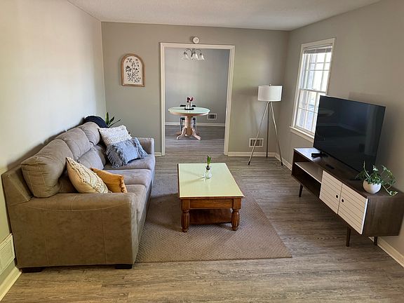 Living room (dining room in background)