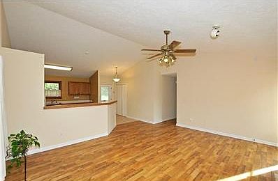 Great room offers laminate flooring, lots of window to allow natural light to beam.  Vaulted ceilings, kitchen opens to great room with gas fireplace.   New deck and so much more.
