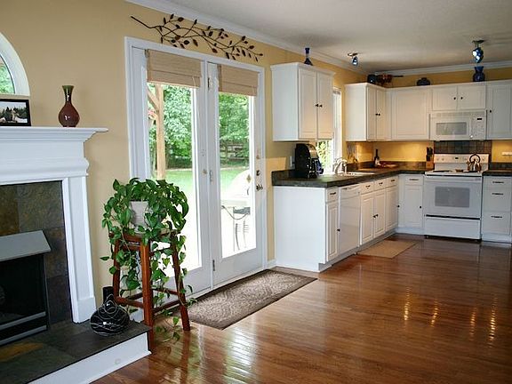 Hardwood floors & stone countertops are a few of the many upgrades...