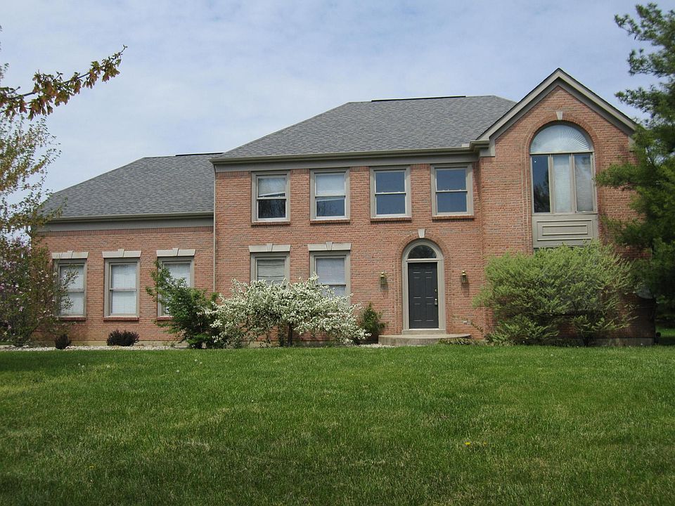 2 story brick with side entry garage.