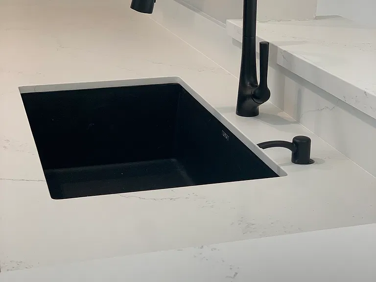 Quartz countertops and granite sink