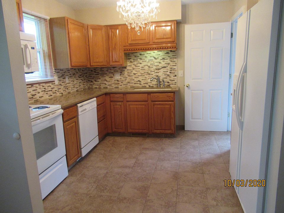 Kitchen with Quartz Countertops and Chandelier