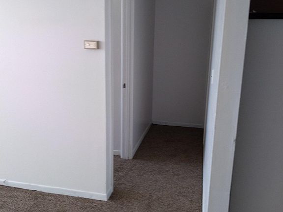 Hallway, kitchen to the right.