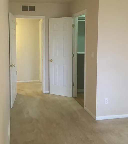 6310-Master Bedroom, View from Masterbath into Master Bedroom, left door goes to hallway, right door goes to walk-in-closet