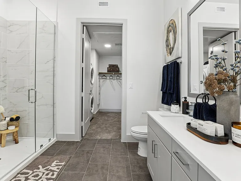 Spa-inspired bathrooms with modern finishes.