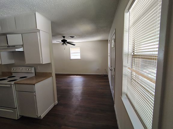 LOOKING TOWARD FAMILY ROOM FROM DINING