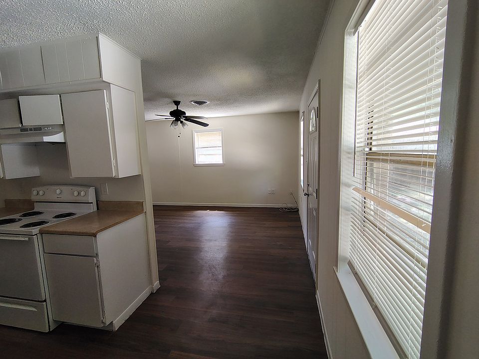 LOOKING TOWARD FAMILY ROOM FROM DINING