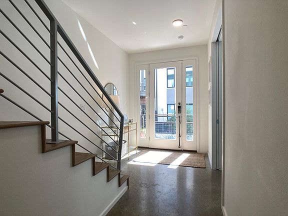 front entry. doorway on left to ground level en suite bedroom, often used as office