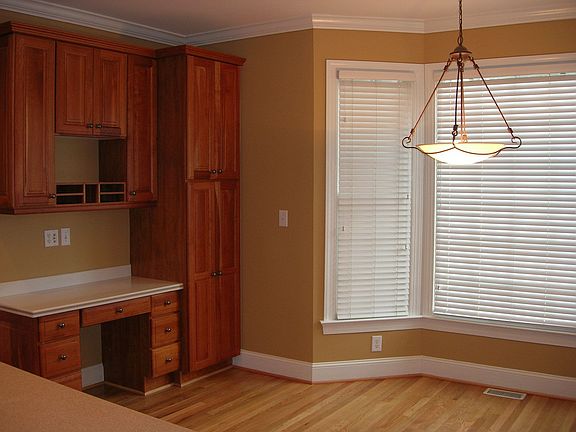 Breakfast nook and recipe desk open to kitchen
