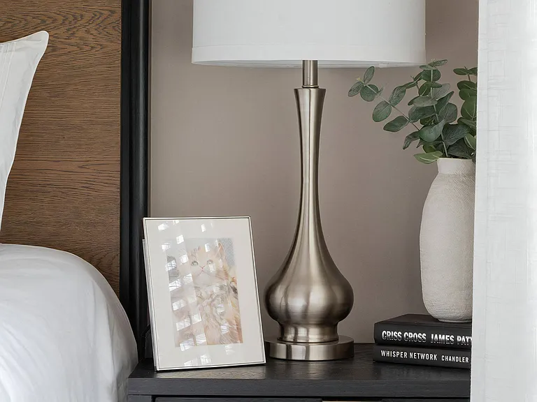 Cozy Bedside Setup with Decorative Accessories and Books