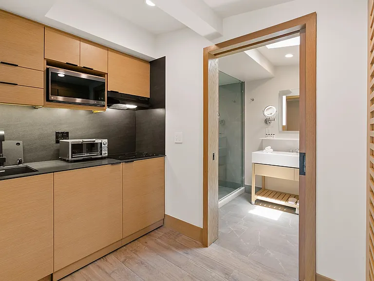 A fully stocked kitchenette with all the essentials and high-end appliances.