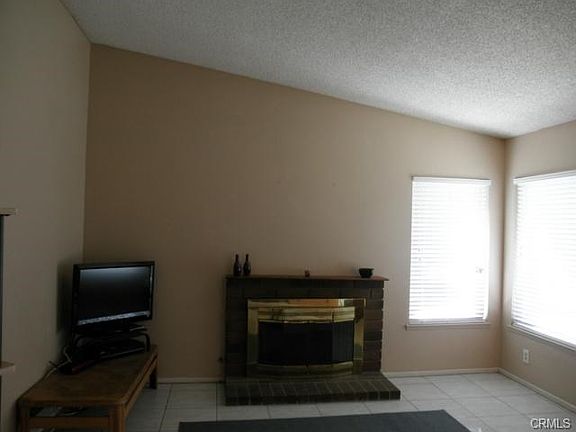 Living Room with Brick Fireplace