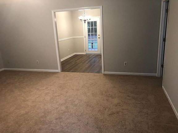 View walking in front door. The door to the right is master bedroom.