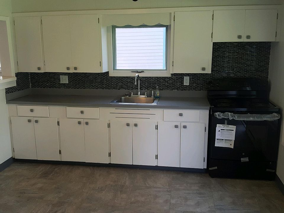Kitchen with new stove and fridge