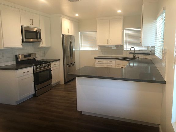 Custom Kitchen with Stainless Steal Appliances