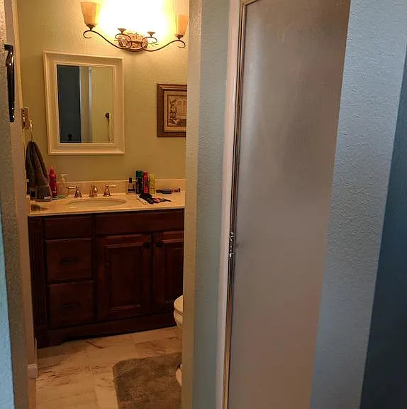 Bedroom #2 shower stall and sink (in background).