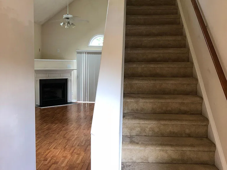 stairs to second floor. kitchen is on left and laundry room is on right