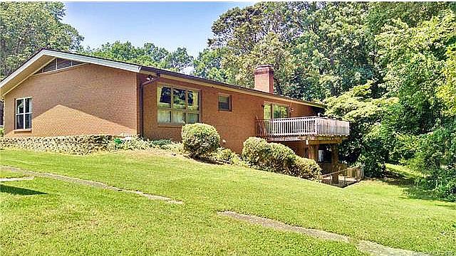 Back. Of house with deck and