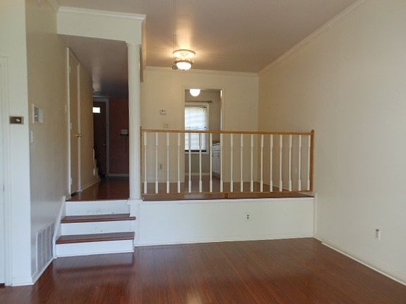 View from the deck shows living room, dining, kitchen entry