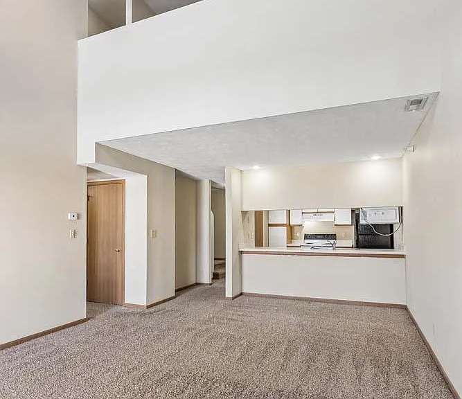 The dramatic vaulted ceiling and expansive open living area create a bright, inviting space designed for both relaxing and entertaining.