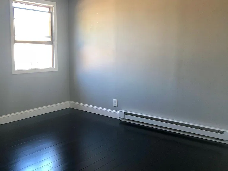 2nd bedroom of 2 on the 3rd floor - again, high ceilings and nice dark floors!