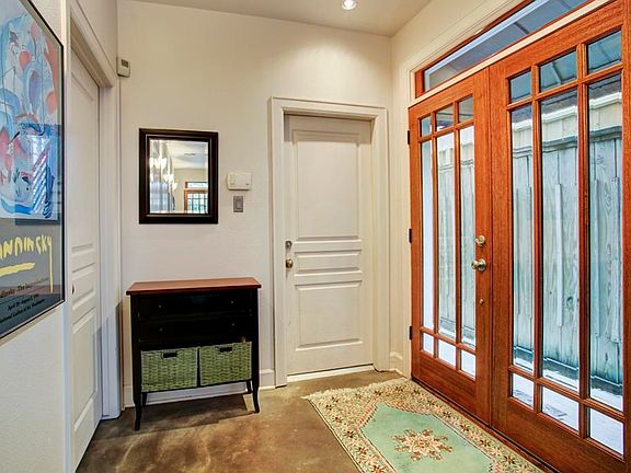 Double glass and wood front doors.