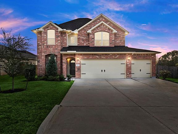 Three Car wide garage and double driveway for plenty of parking...