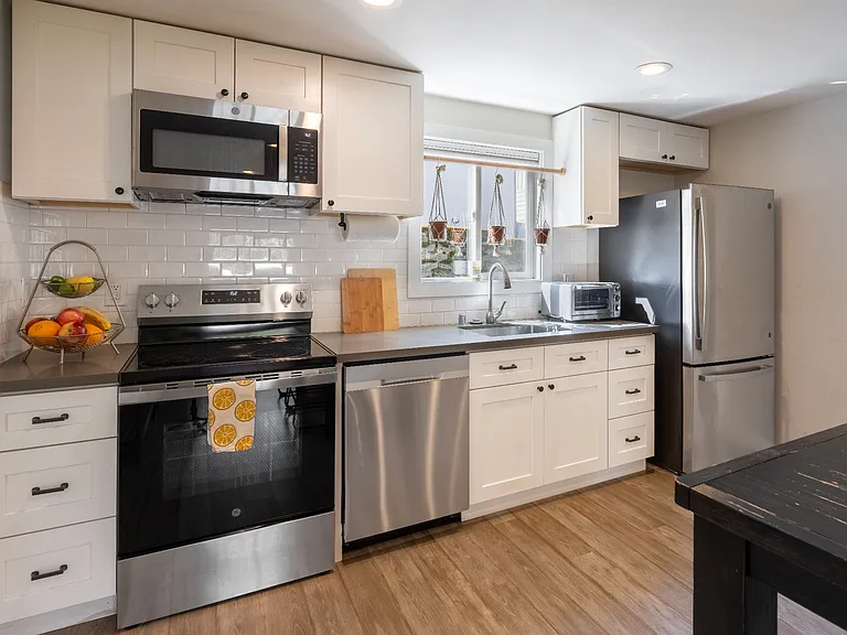 Kitchen stainless steel appliances, open concept