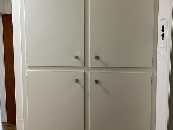 Hallway storage near bathroom and bedroom 2