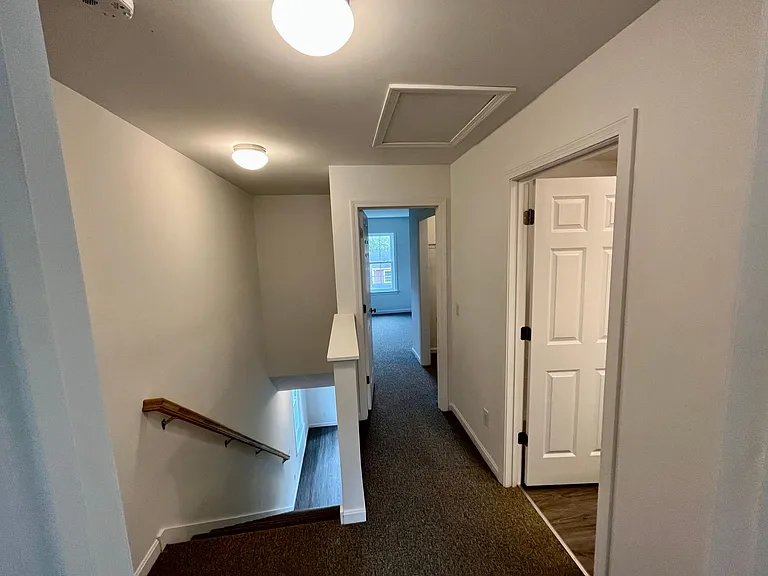 hallway from 2nd bedroom to full bath and master bedroom