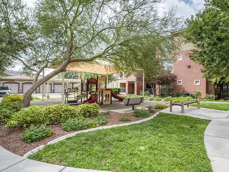 Enjoy a serene day amidst the playful charm of a playground, complete with cozy picnic tables for a delightful outdoor feast