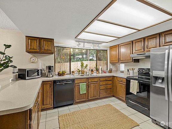 Huge window in kitchen lets in natural light.  This kitchen has ample counter space!>