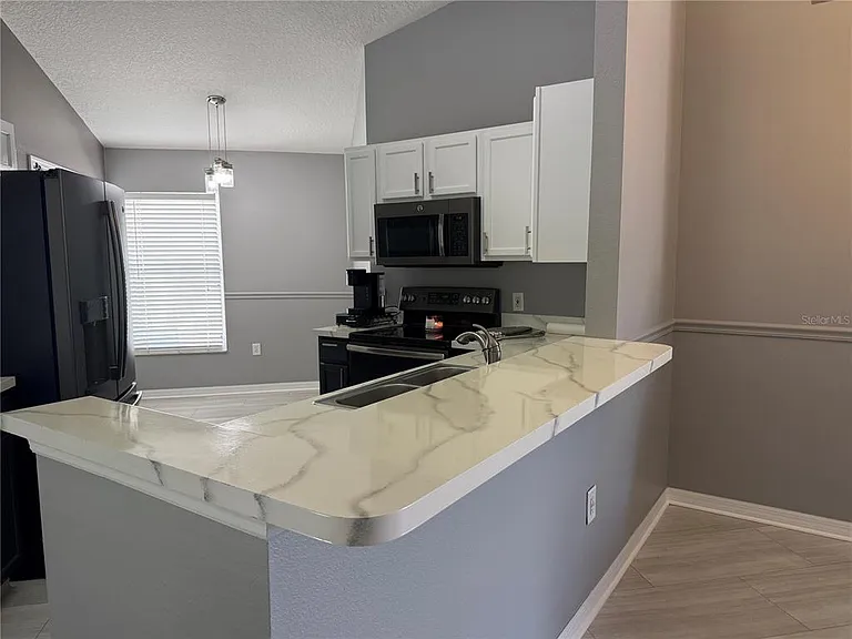 16212 Coopers Hawk Ave — Photo 4