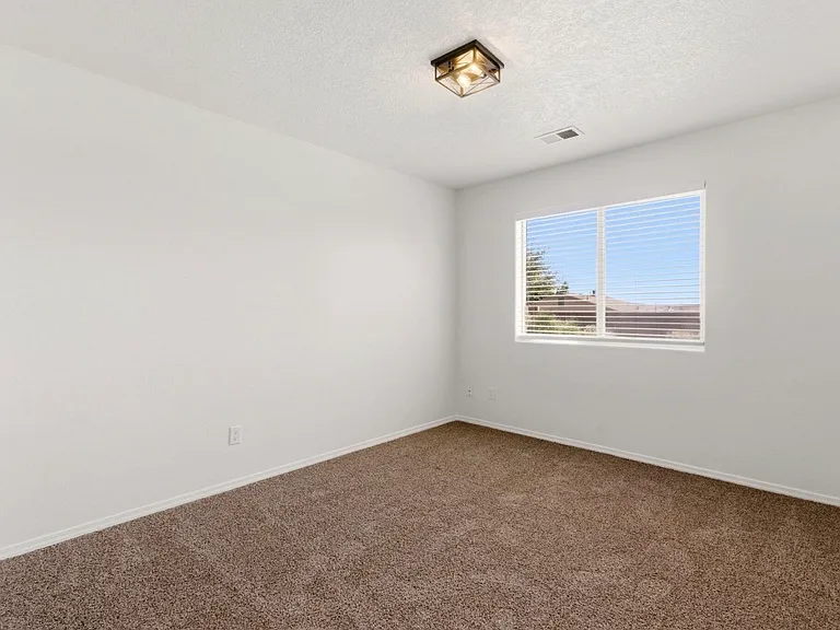 Second bedroom with yard view