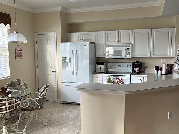 OPen concept eat in kitchen with walking pantry and Dining room to the right.