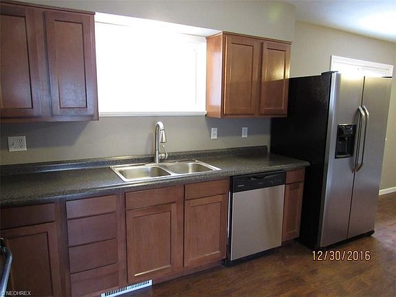 Brand new kitchen with large window over sink that offers a view of the big, fenced in back yard. All new appliances and a Moen faucet await the new chef of the house.