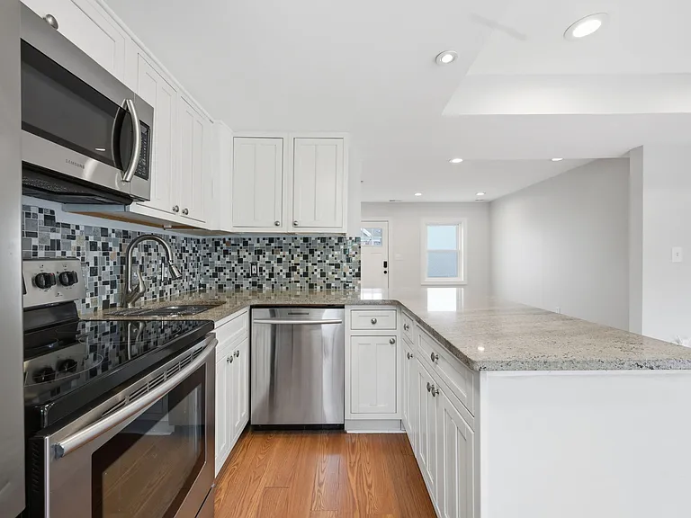 Updated Kitchen with Breakfast Bar and Stainless Steel Appliances