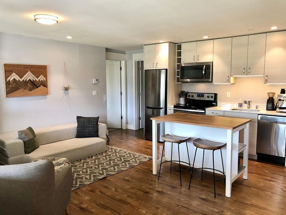 LIving and dining room. Also has privacy shades.