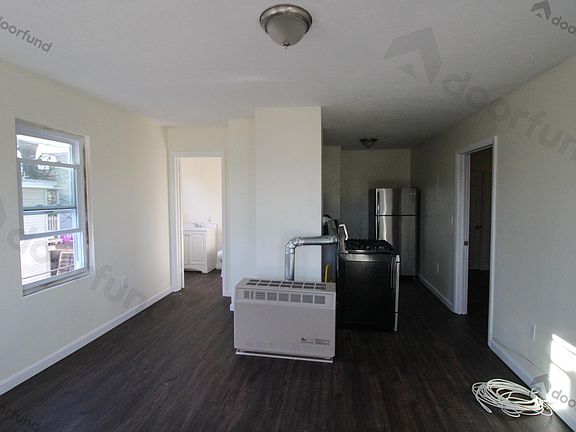 Living Room with view of Kitchen and Bathroom