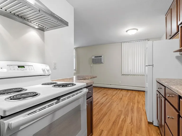 Step into modern living at Central Lakes of Uptown. This spacious kitchen features sleek appliances and elegant finishes, perfect for culinary enthusiasts. Embrace a vibrant lifestyle and make this space your own. Schedule a visit today!