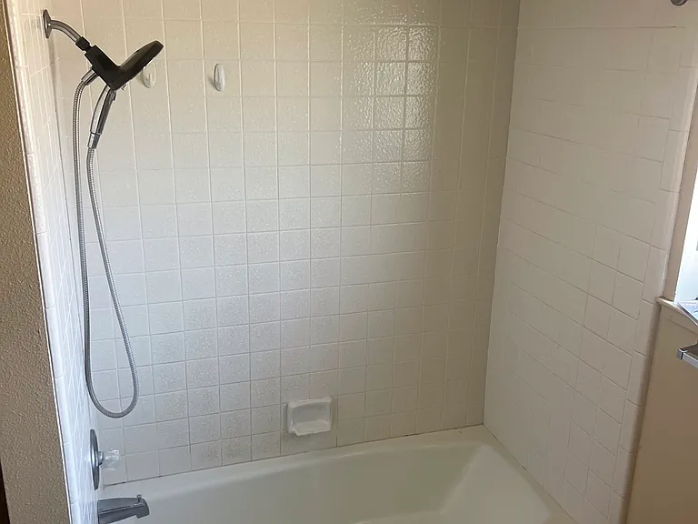 Upstairs second bathroom shower and tub