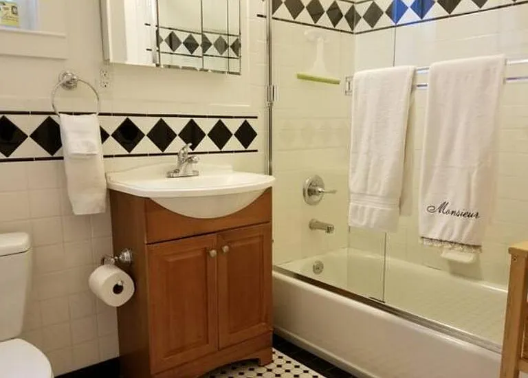 Newly renovated bathroom with shower over tub