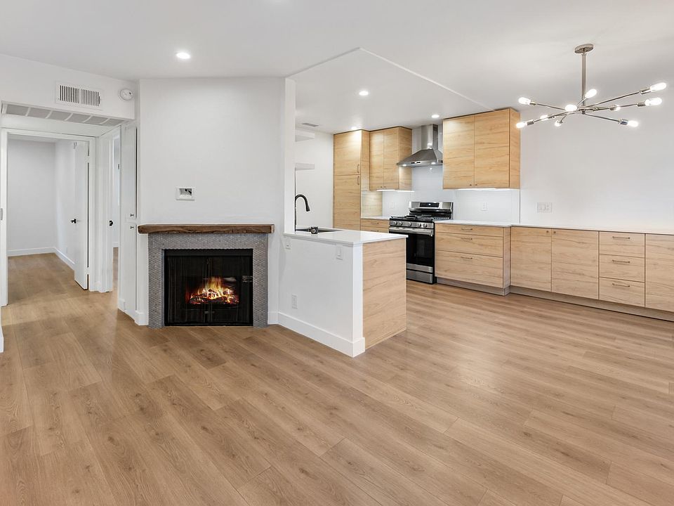 Great room/ kitchen w/ ample storage and HDMI and power above the fireplace for a clean install of a TV above. Designer lighting on dimmers everywhere