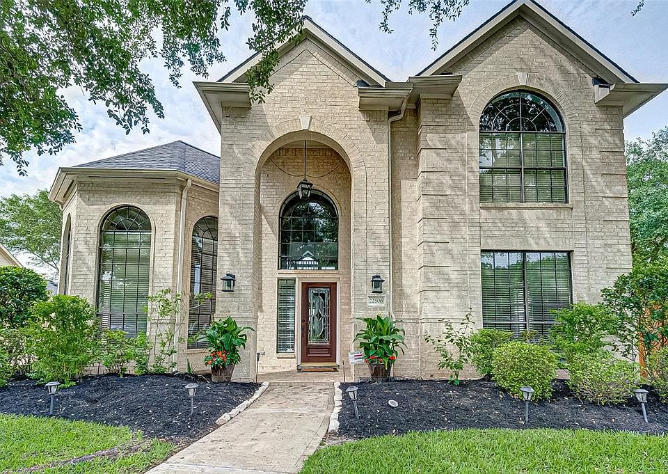 Meticulously landscaped and well maintained yard makes this front view spectacular.