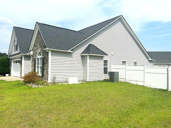 Large patio on the right side of home