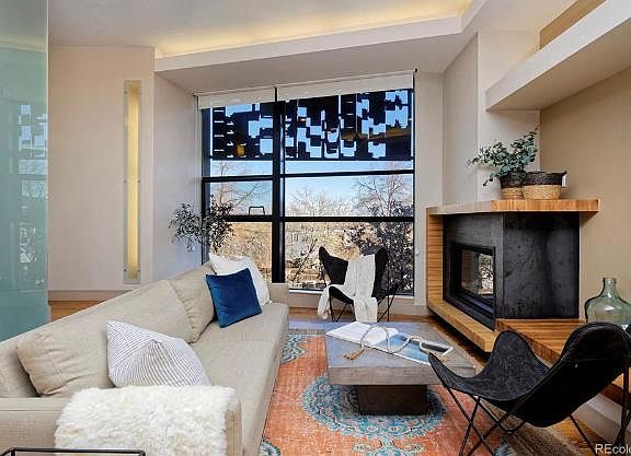 Living room overlooking community garden and downtown