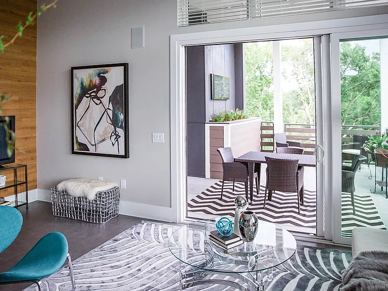 Over-sized glass doors create a flowing living space that is both in and outdoors