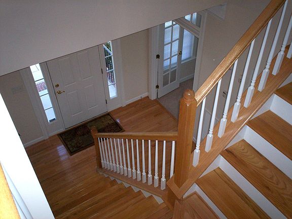 Hardwood Floors & Stairs make for a Very Grand Entrance Way
