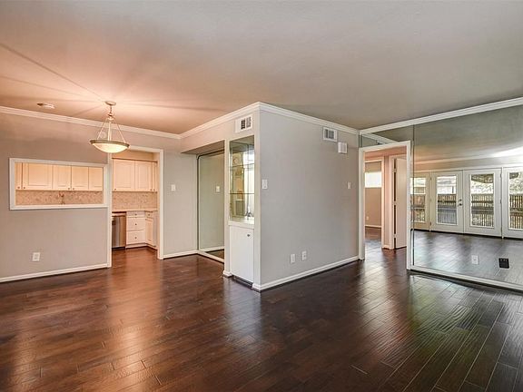 Open flow from the kitchen to the living and dining areas.