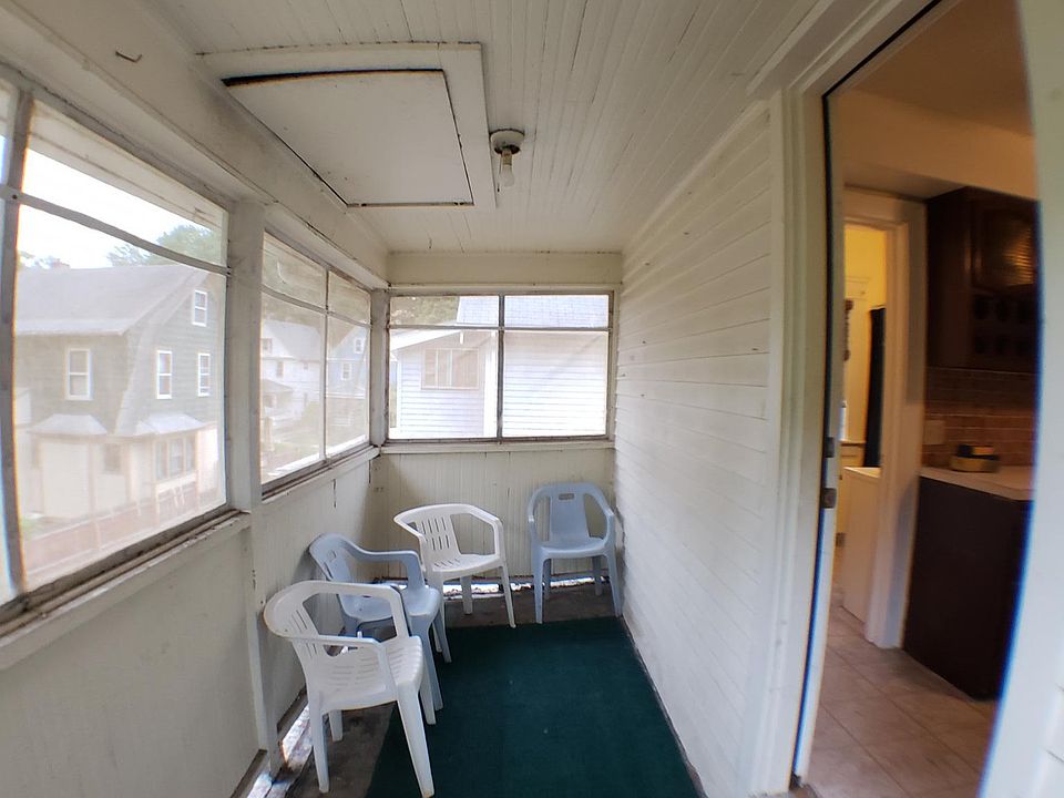 Screened in porch of kitchen off back staircase from your private parking space next door to the back stair you also have a locked private staircase for guest through beveled wood doors